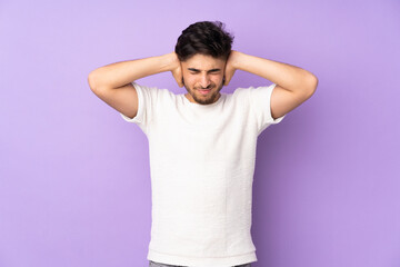 Arabian handsome man over isolated background frustrated and covering ears