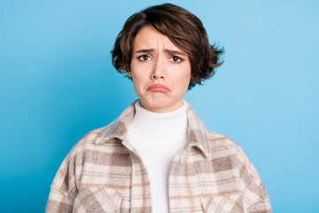 Photo of young brown hair woman unhappy sad upset displeased offended fail isolated over blue color...