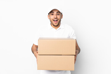 Delivery Arabian man isolated on blue background with surprise facial expression