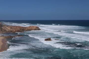waves crashing on rocks