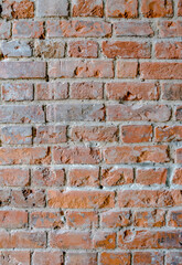 Old red brick wall. Vertical background, loft interior.