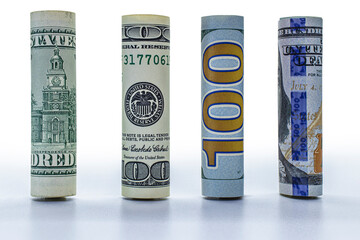 One hundred dollar banknote rolled into a tube. Close-up. Isolated white background. Concept for design