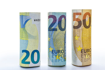 Euro banknotes rolled into a tube. European Union money. Close-up. Isolated white background. Concept for design