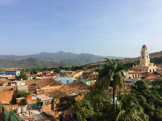Fototapeta na wymiar Iconic view of the Cuban city of Trinidad, in the province of Sancti Spiritus, with the Escambray Mountains in the background on a clear day. Panorama of colonial city in Cuba.