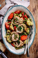 Turkey roll with pesto baked with vegetables .style rustic.