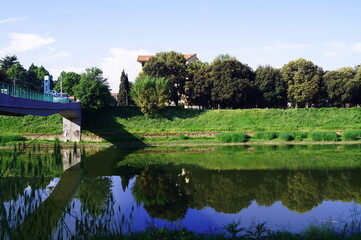 Fototapeta premium Pedestrian walkway of the Isolotto over the Arno river in Florence, Italy