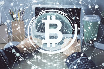 Double exposure of woman hands typing on computer and crypto market theme hologram drawing. Blockchain concept.