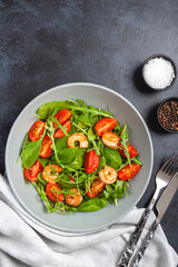 Salad of shrimp prawn and fresh vegetable, leaves of arugula, lettuce.