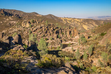 Rock formations in Pinnacles National Park in California, the destroyed remains of an extinct volcano on the San Andreas Fault. Beautiful landscapes, cozy hiking trails for tourists and travelers.