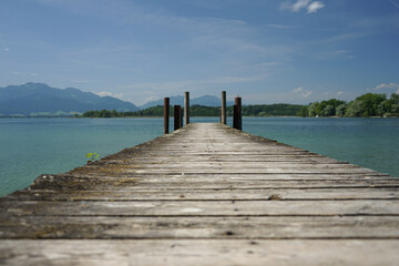 Weathered landing stage shot from low angle with lines converging on the horizon