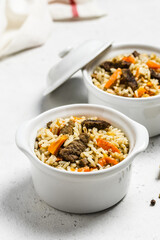 Beef and rice, side dish in pots. Space for text.