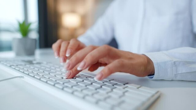 Female hands typing on a computer keyboard. Concept of remote work.