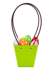 Easter eggs decorated in green basket isolated on the white background
