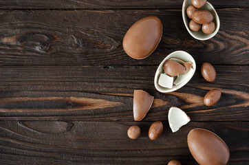 Chocolate Easter Eggs on the woden background with copy space
