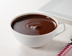 Taza de chocolate , desayuno, vista cenital. Cup of chocolate, breakfast, overhead view.