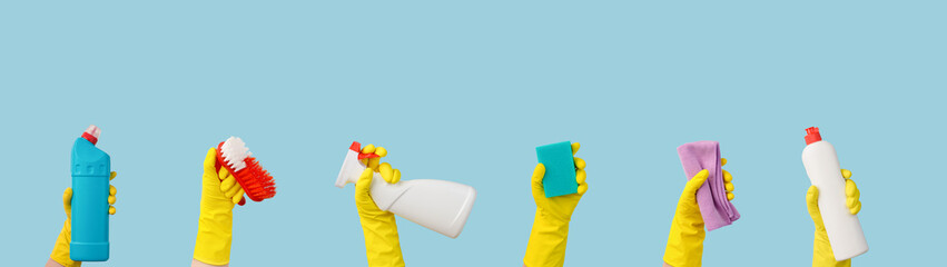 Hands in rubber gloves with cleaning supplies banner with free space for text - obrazy, fototapety, plakaty