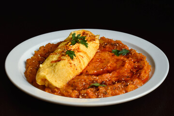 Delicate French omelet with spicy thick pumpkin sauce.