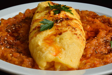 Delicate French omelet with spicy thick pumpkin sauce.