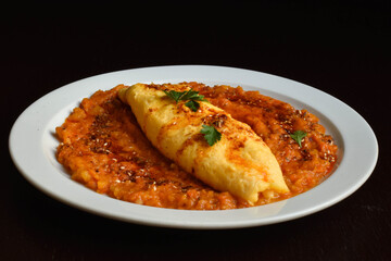 Delicate French omelet with spicy thick pumpkin sauce.