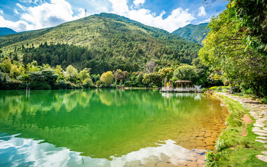Scenic crescent moon lake pool view with Cangshan mountain water reflection in the Butterfly spring...