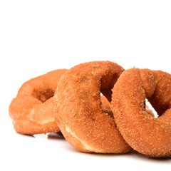 a pile of rosquillas, typical spanish donuts on white background