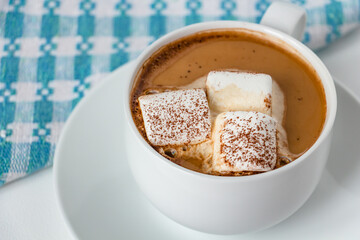 cup of aromatic coffee or cocoa, white delicious marshmallows in a white cup on a white background, the best breakfast