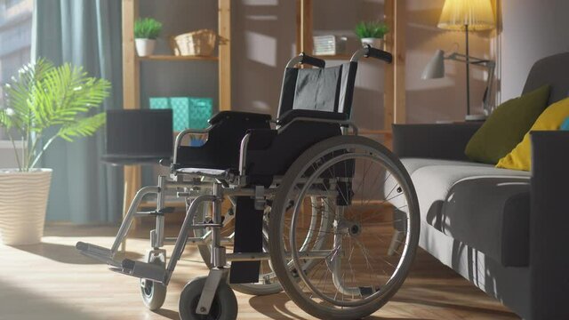 wheelchair on the background of a modern apartment on a sunny day close-up nobody