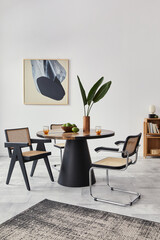 Stylish composition of dining room interior with design table, modern chairs, decoration, tropical...