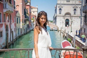 Fototapeta na wymiar Beautiful Tourist Woman with White Dress in Venice ,Italy 