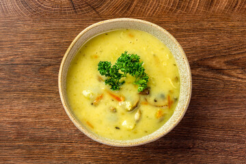 Mushroom soup in a clay plate