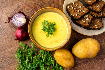 Mashed potato soup in a clay plate 