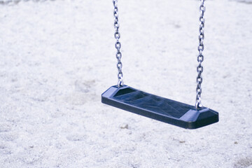 Wooden swing with metal chains for children