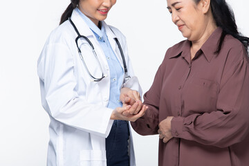 Fototapeta premium Young Doctor examines elderly asian woman and health check up on heart