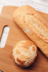 loaf with bun fresh baked goods home cooking wood board fresh flavor