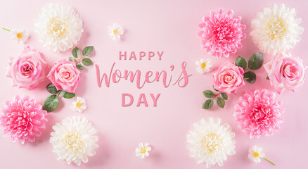 Happy women's day concept, pink roses and beautiful flower frame on pastel background with Happy Women's Day text. Flat lay ,top view.