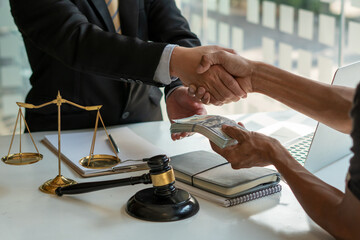 A businessman tries to bribe the judge with money in order to win the lawsuit. The concept of corruption and cheating