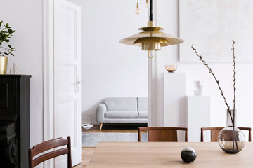 Stylish scandinavian interior of living room with design grey sofa, retro wooden table, mock up...