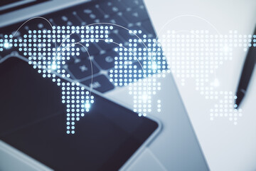 Abstract creative world map with connections on modern laptop background, international trading concept. Multiexposure