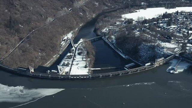 Drone Aerial views of the Keller National Park in Winter. The barrier lake Edersee is partly frozen. The Ederstausee is located in Hesse near the town Waldeck in Germany, Europe.