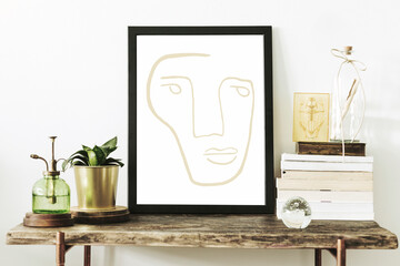 Stylish scandinavian interior of living room with wooden console, mock up poster frame, beautiful plants, book and sprinkler. Modern composition of home interior.  Template.