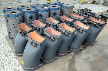 Gas turbine burner heads placed on the floor to wait for inspection.