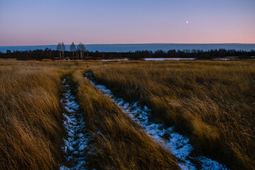 road through the field at dusk