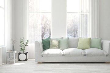 White living room with sofa and winter landscape in window. Scandinavian interior design. 3D illustration