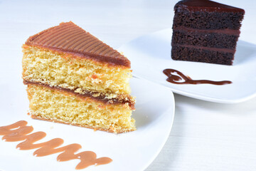 Cup of Colombian coffee, accompanied by baked cake on white wooden background