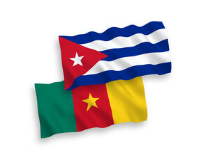 National vector fabric wave flags of Cameroon and Cuba isolated on white background. 1 to 2 proportion.