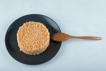 Delicious bulgur pilaf on a dark plate