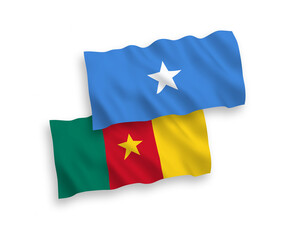 Fototapeta premium National vector fabric wave flags of Cameroon and Somalia isolated on white background. 1 to 2 proportion.