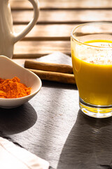 The traditional Indian drink turmeric milk is a golden milk with cinnamon for a healthy healing breakfast that prevents diseases.