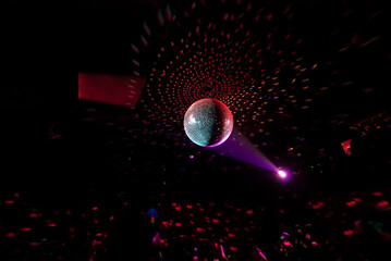 Disco ball at the party with the bright lights