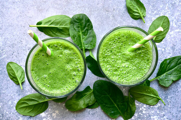 Detox spinach smoothie in a glasses. Top view with copy space.